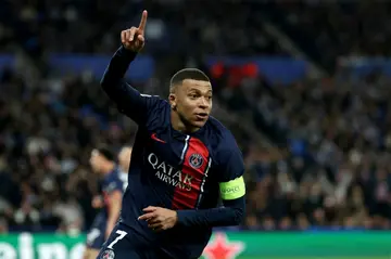 Paris Saint-Germain forward Kylian Mbappe celebrates scoring his team's second goal as the Ligue 1 side eased through