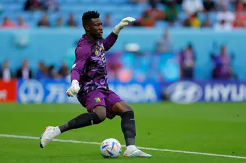 Cameroon goalkeeper Andre Onana clears the ball during a 2022 World Cup group match against Switzerland in Qatar.