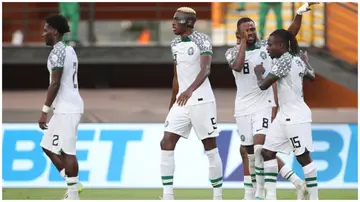 Nigeria players celebrate after their first goal during the CAF Africa Cup of Nations group stage match against Guinea-Bissau.