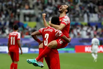 Jordan's players celebrate their equaliser, but even better was to come