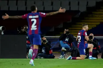 Barcelona midfielder Fermin Lopez (R) celebrates scoring with a brilliant drive from the edge of the box in the first half against Shakhtar Donetsk