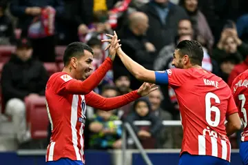 Atletico Madrid forward Angel Correa (L) celebrates his goal which proved the winner against Almeria on Sunday in La Liga
