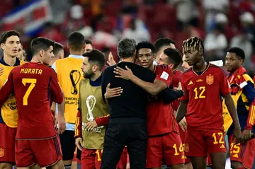 Spain's coach Luis Enrique congratulates his team on their victory after thrashing Costa Rica