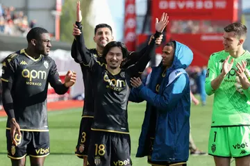 Takumi Minamino (C) celebrates with his Monaco teammates after their 2-0 win at Brest on Sunday