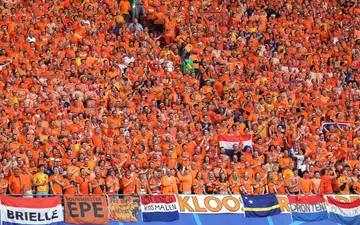 Dutch fans cheer during the match between the Netherlands and France in Leipzig on June 21