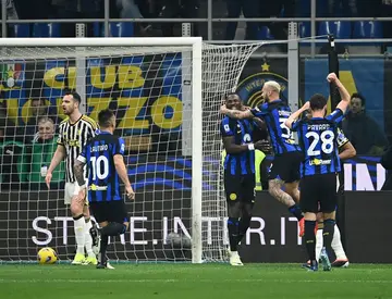 Inter Milan players celebrate Federico Gatti's decisive own goal