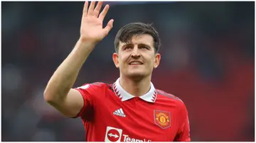 Harry Maguire waves during the Premier League match between Manchester United and Aston Villa at Old Trafford. Photo by James Gill.