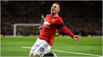 Wayne Rooney celebrates after scoring during the FA Cup Quarter Final match between Manchester United and Arsenal at Old Trafford. Photo by Laurence Griffiths.