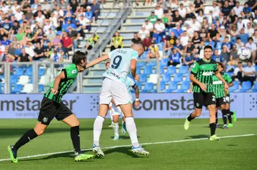 Edin Dzeko (C) has a century of Serie A goals after his brace at Sassuolo