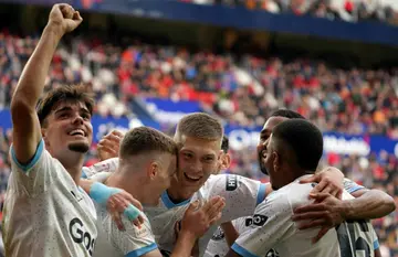 Girona's Ukrainian winger Viktor Tsygankov (2L) celebrates scoring his team's third goal in the comeback win over Osasuna