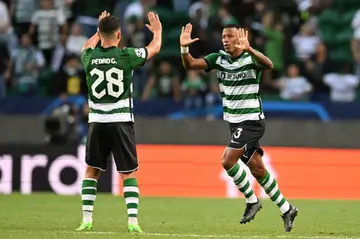 Sporting Lisbon forward Arthur Gomes (R) celebrates after scoring against Tottenham