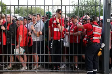 Liverpool fans stand outside the Stade de France before last month's Champions League final