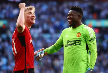 Rasmus Hoejlund and Andre Onana celebrate after the penalty shootout during the Emirates FA Cup Semi Final match between Coventry City and Manchester United at Wembley Stadium