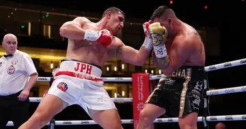 Australia's Justis Huni landing a punch on South Africa's Kevin Lerena.