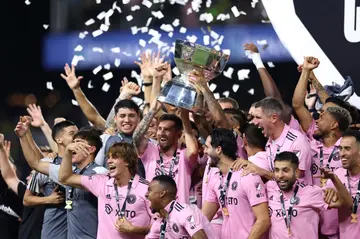 Lionel Messi of Inter Miami hoists the trophy with his teammates after defeating Nashville SC to win the Leagues Cup