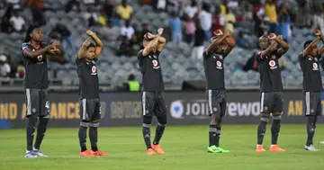 Orlando Pirates players throw up the skull and crossbones sign.