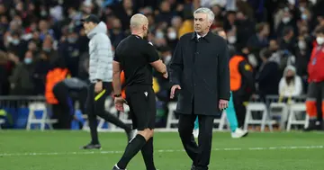 Carlo Ancelotti shakes hands with Szymon Marciniak, referee of the match, during the UEFA Champions League Quarter Final Leg Two match between Real Madrid and Chelsea. Photo By Oscar J. Barroso.