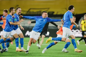 KI Klaksvik players celebrate after winning the penalty shootout against BK Hacken in the second qualifying round