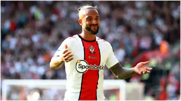 Theo Walcott reacts during the Premier League match between Southampton FC and Liverpool FC at St. Mary's Stadium. Photo by Matt Watson.