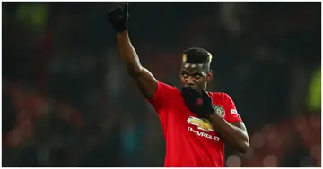 Paul Pogba waves to the fans at full time during the Premier League match between Manchester United and Newcastle United at Old Trafford. Photo by Robbie Jay Barratt.