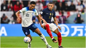  Kylian Mbappe in action with Jude Bellingham during the FIFA World Cup match between France and England at Al Bayt Stadium. Photo by Baptiste Fernandez.