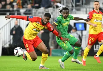 Lens defender Kevin Danso (L) up against Moses Simon of Nantes during a recent game