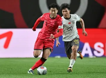 South Korean skipper Son Heung-min gets away from China's Xie Wenneng