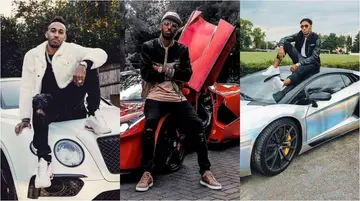 Aubameyang posing with some of his cars.