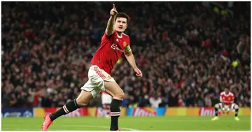 Harry Maguire celebrates after scoring their side's second goal during the UEFA Champions League group F match between Manchester United and Atalanta at Old Trafford. Photo by Charlotte Tattersall.