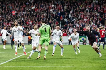 Emiliano Martinez's (centre) penalty heroics saw Aston Villa past Lille in the Europa Conference League quarter-finals