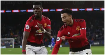 Jesse Lingard and Pogba celebrate scoring their fifth goal during the Premier League match between Cardiff City and Manchester United. Photo by Tom Purslow.
