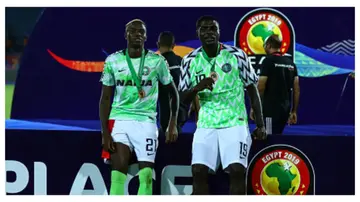 Victor Osimhen and John Ogu in the Nigerian national football team colours during the 2019 AFCON tournament.