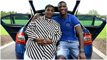 Moises Caicedo poses alongside his mother at Chelsea Training Ground. Photo by Darren Walsh.