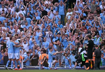 Phil Foden (bottom right) scored inside two minutes as Manchester City won the Premier League on Sunday