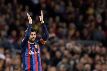 Barcelona's Pique applauds Camp Nou supporters as he goes off in his last home game
