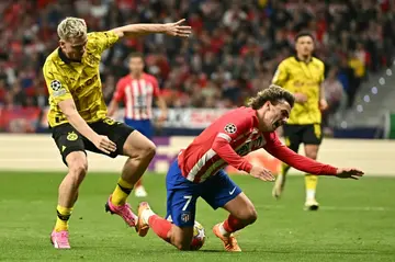 Antoine Griezmann expects Atletico Madrid will "suffer" in the second leg at Borussia Dortmund next Tuesday