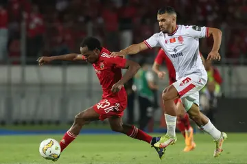 Wydad Casablanca midfielder Jalal Daoudi (R) chases Al Ahly forward Percy Tau during the second leg of the 2023 CAF Champions League final