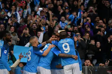 Eljif Elmas (C) is surrounded by Napoli teammates to celebrate his decisive third goal