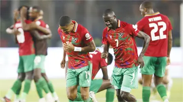 Namibian players celebrate their victory after the Africa Cup of Nations 2024 Group E football match against Tunisia.
