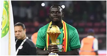 Sadio Mane holds the AFCON trophy prior to the ceremony after winning the Africa Cup of Nations (CAN) 2021 final football match between Senegal and Egypt. Photo by CHARLY TRIBALLEAU.