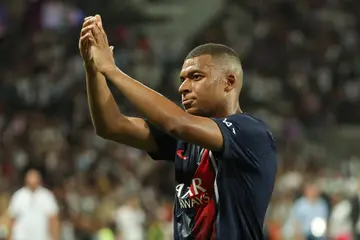 Paris Saint-Germain star, Kylian Mbappe, applauds the fans amid reports that Real Madrid will make a late offer for the forward.