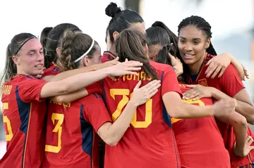 Spain players celebrate a goal against Jamaica