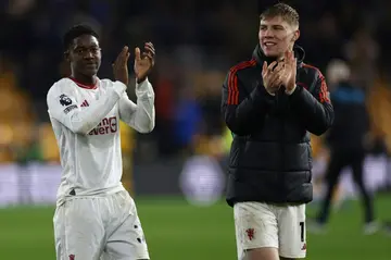 Kobbie Mainoo (left) scored the dramatic winner in Manchester United's 4-3 win at Wolves