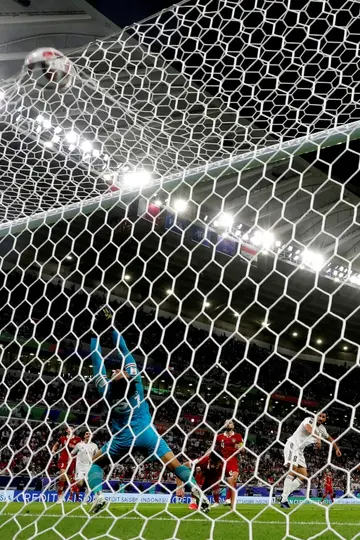 Indonesia's goalkeeper  Ernando Ari concedes a third goal