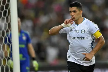 Luis Suarez celebrates after scoring the second of two goals in his farewell appearance for Gremio in a 3-2 win over Fluminense at the Maracana Stadium