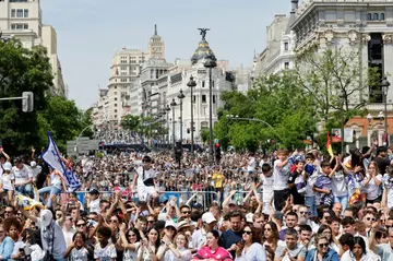 Thousands of Madrid fans filled the streets to celebrate La Liga glory with their heroes and they hope more is on the way