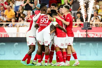 Table toppers: Monaco's players celebrate scoring their third goal