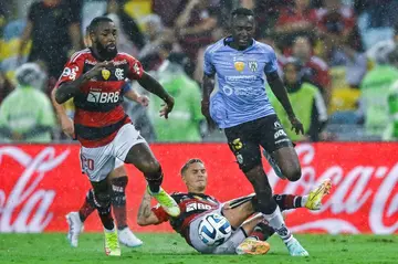 Flamengo right-back Guillermo Varela (center) and midfielder Gerson (left) during a February 28 home match against Ecuador's Independiente del Valle in Rio de Janeiro