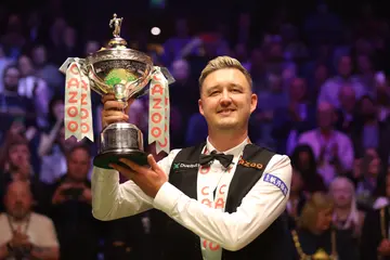 Kyren Wilson with the Cazoo World Snooker Championship trophy
