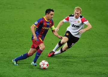 Xavi, Paul Scholes, Barcelona, Manchester United, Premier League, La Liga, Champions League, Europa League